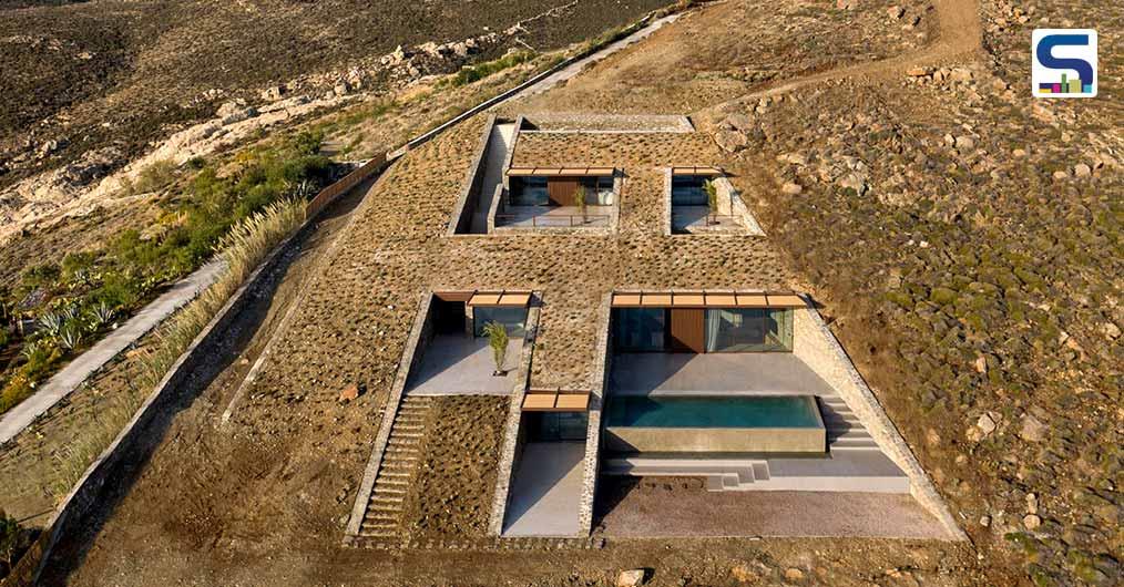 Athens-Based Architecture Firm Designed Cave-Like Home Into A Rocky Cliffside