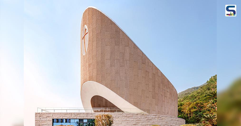 Inspired by biblical archetypes, the church resembles an ark resting on a rock, located at a mountains base amidst a forest with views of the town.