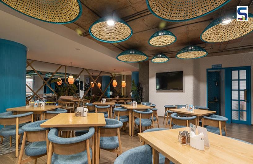 Symphony of Blues, Cane, and Wood in Cafe Azure | DS2 Architecture | Bengaluru