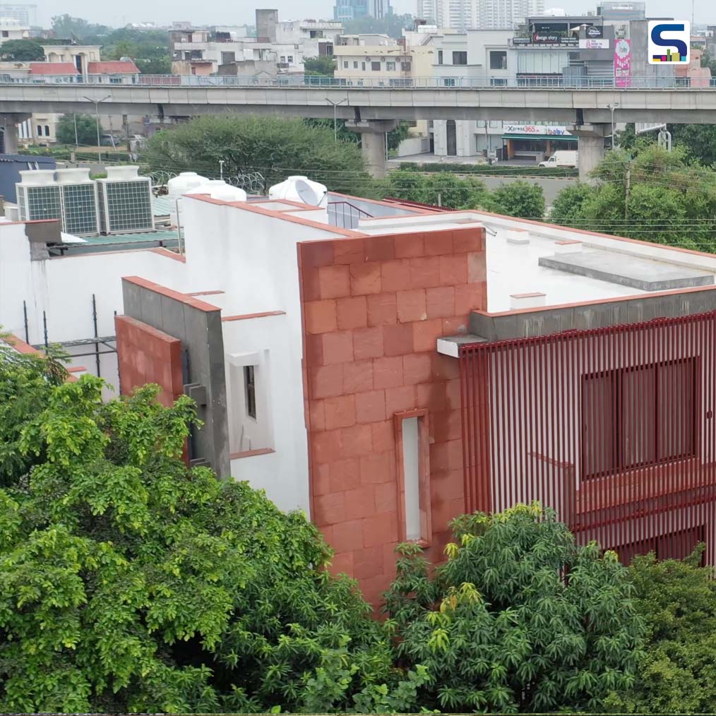 The Red Sandstone Façade of This House in Gurgaon Emerges From Within The 49 Trees | Renesa