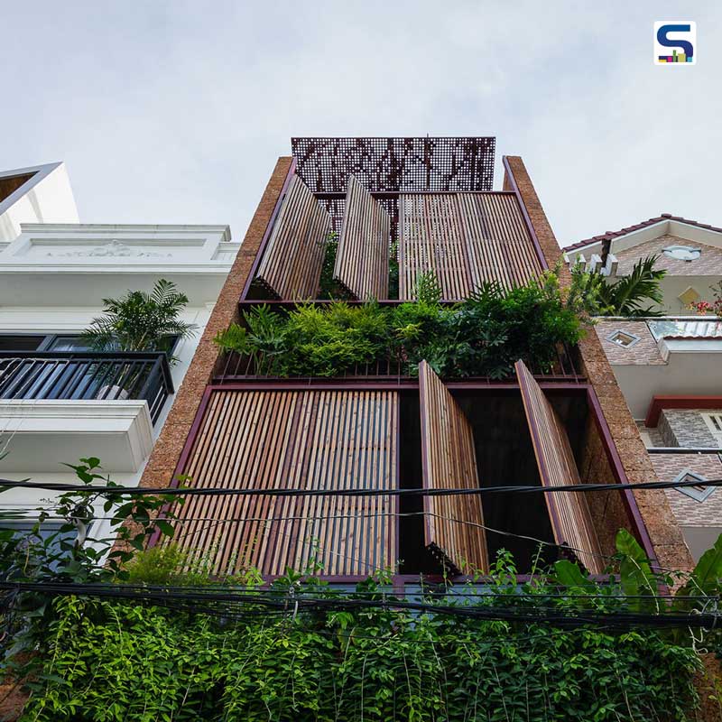This Sustainable House in Vietnam Breathes Through 8 Revolving Wooden Doors on Its Facade | H House | AD9 architects