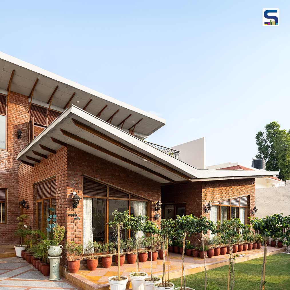 Exposed Red Brick Wall With Butterfly Roof Accentuates The Beauty of Rawness Of This Tapered House in Chandigarh | Studio Mohenjodaro