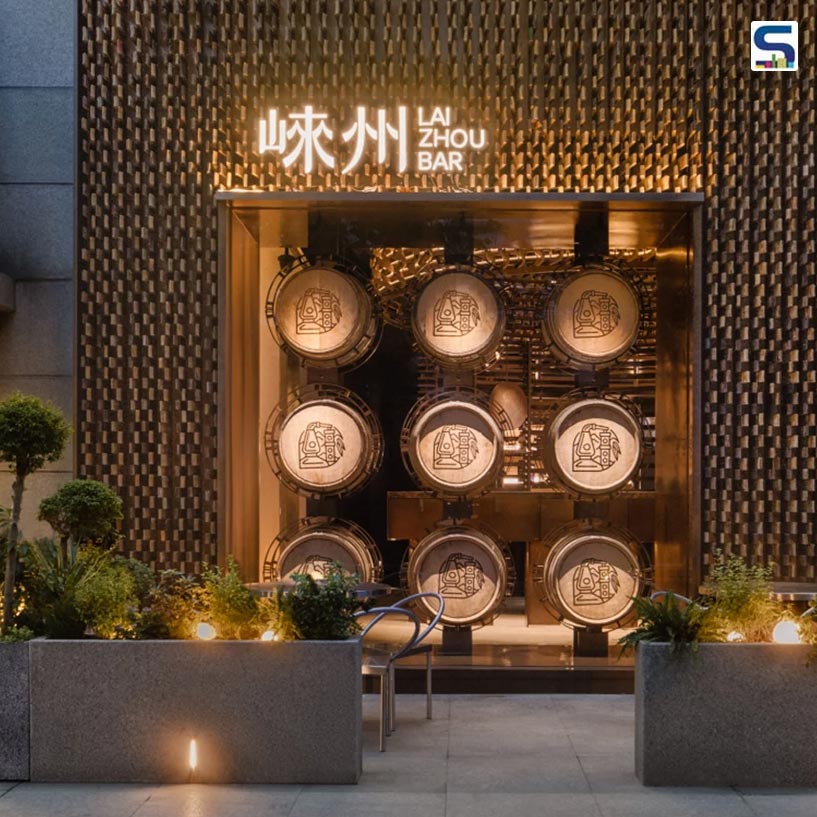 Chinese interiors studio RooMoo has undertaken a remarkable eco-conscious project, repurposing nearly 6,000 oak pieces from discarded distillery barrels to fashion the captivating interiors of Laizhou Bar in Shanghais vibrant Xuhui District.
